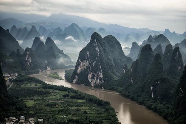 Aerial view of the Li River curving between limestone karst peaks around Mashan mountain in Yangshuo county, near Guilin, China