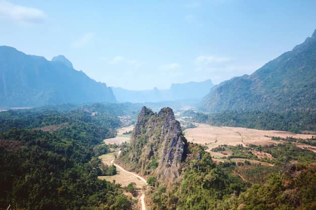 Limestone karst peaks rising above the Nam Song valley, seen from the Nam Xay viewpoint at Vang Vieng in Laos